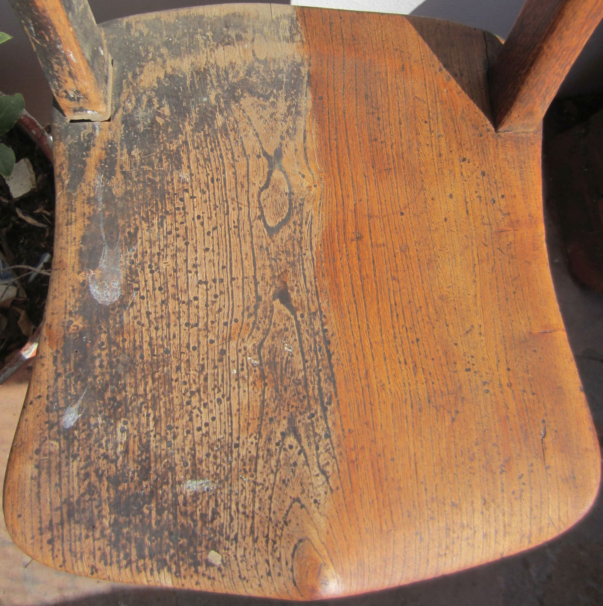 A half-restored wooden chair